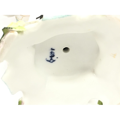 1004 - A pair of Chelsea porcelain Potpourri vases , some damage . 21cm tall approximately. This lot cannot... 