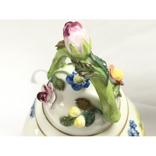 1005 - A Dresden urn & cover, hand painted with a figural scene and floral decoration . 19cm tall. This lot... 