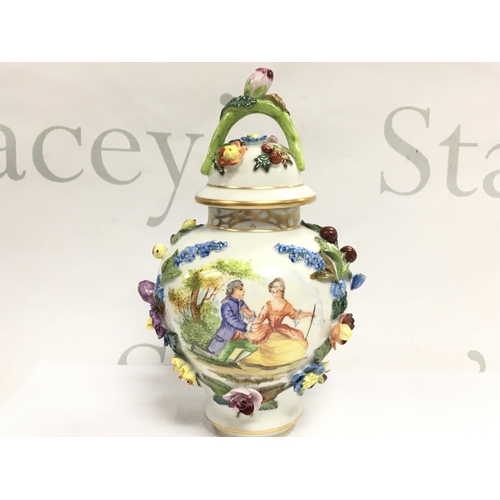 1005 - A Dresden urn & cover, hand painted with a figural scene and floral decoration . 19cm tall. This lot... 