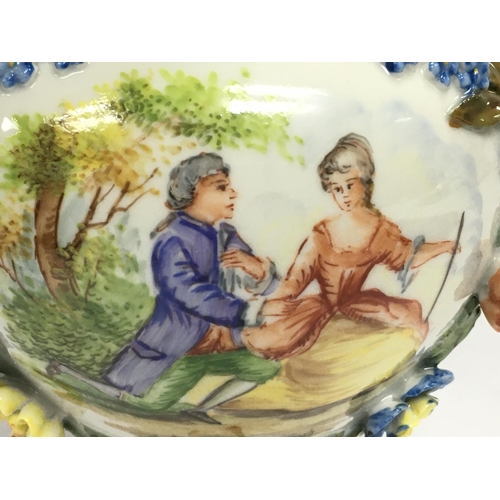 1005 - A Dresden urn & cover, hand painted with a figural scene and floral decoration . 19cm tall. This lot... 