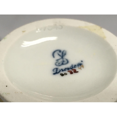 1005 - A Dresden urn & cover, hand painted with a figural scene and floral decoration . 19cm tall. This lot... 