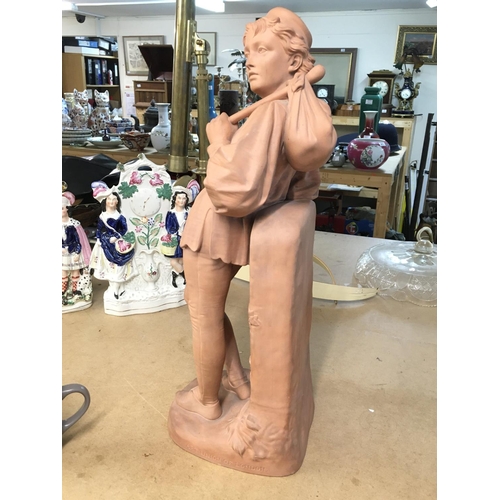 1014 - A terracotta figurine stamped art Union of London. 53cm tall.