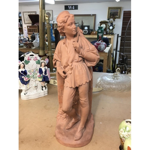 1014 - A terracotta figurine stamped art Union of London. 53cm tall.