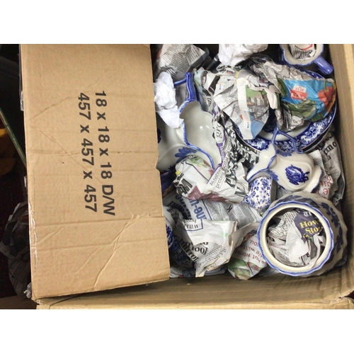1016 - Two boxes containing decorative blue and white ceramics and other ceramics including a Lladro style ... 