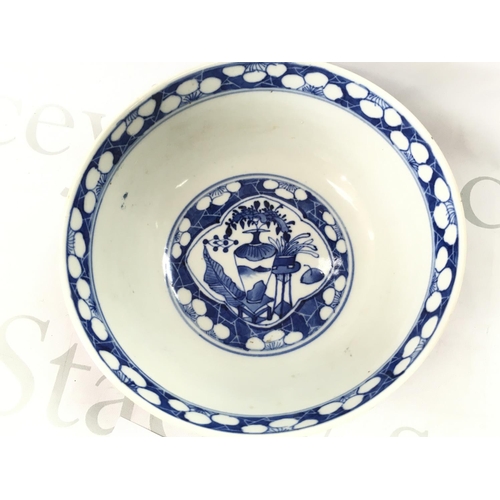 859 - A 19th century Chinese blue and white bowl decorated with figures and cherry blossom. Four character... 