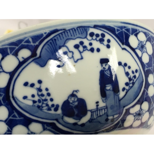 859 - A 19th century Chinese blue and white bowl decorated with figures and cherry blossom. Four character... 