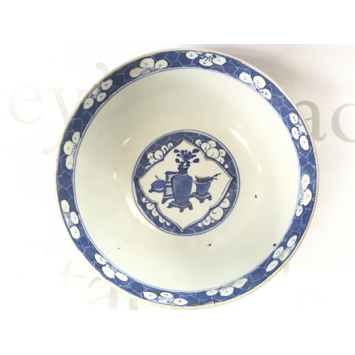 860 - A 19th century Chinese blue and white bowl with a four character mark at the base, 18cm wide. Hairli... 