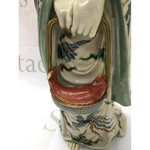870 - A large Cantonese Guan Yin porcelain figure, damaged fish tail. 45cm tall. This lot cannot be posted