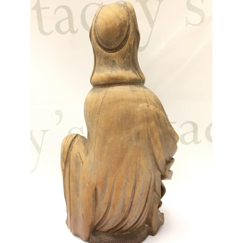 871 - A carved wooden Guanyin figure ,27cm tall. Postage category B