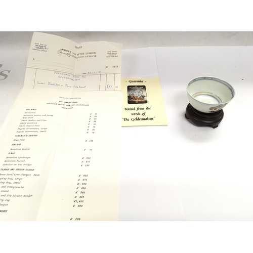 872 - An Imari bamboo and pine tea bowl raised from the wreck of the Geldermalsen with COA.