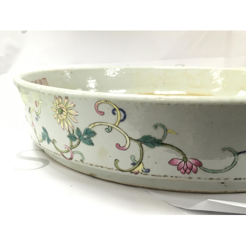 880 - A Chinese Famille Rose Courtyard scene large dish , 41cm wide. No obvious large damage or restoratio... 