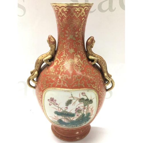 882 - A Chinese Wall pocket with dragon handles and gilt decoration , enamel floral panel . 20cm tall. Thi... 
