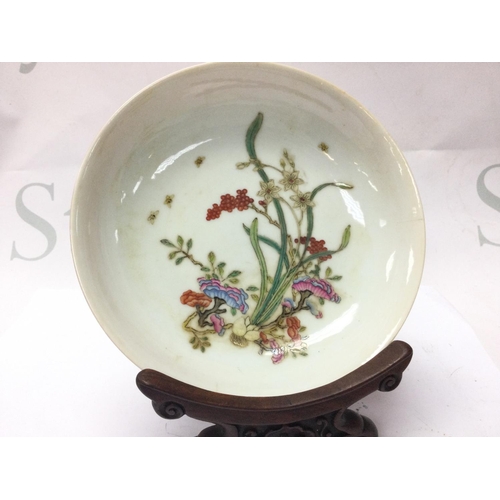 890 - A Chinese dish with floral design, copped red glaze on underside and a six character Yongzheng mark ... 