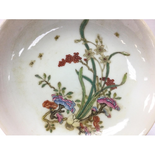 890 - A Chinese dish with floral design, copped red glaze on underside and a six character Yongzheng mark ... 