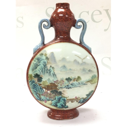 892 - A Chinese moon flask vase with painted panel landscape scene design , 21cm tall. This lot cannot be ... 