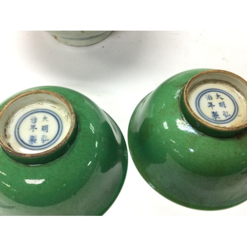 893 - A collection of Chinese bowls including yellow and green glaze, blue and white frog bowl . This lot ... 