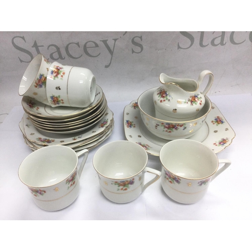 1043 - A Royal Stafford bone china tea and dinner set plus a Czechoslovakian tea set with floral spray deco... 