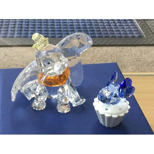 1047 - A Boxed Swarovski Disney figure of Dumbo, together with a trinket box with an blue coloured elephant... 