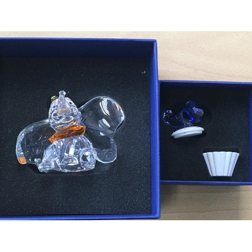 1047 - A Boxed Swarovski Disney figure of Dumbo, together with a trinket box with an blue coloured elephant... 