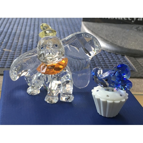 1047 - A Boxed Swarovski Disney figure of Dumbo, together with a trinket box with an blue coloured elephant... 