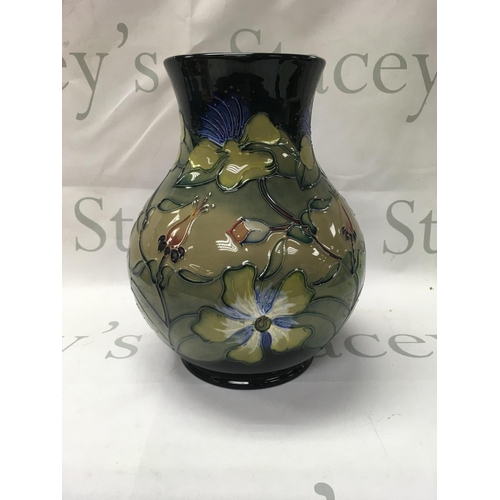 1053 - A Moorcroft Hyericum Rachel Bishop vase 25 cm .