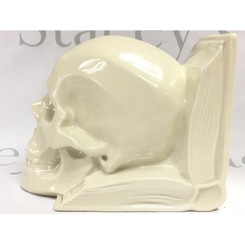 1055 - A rare Hungarian Herend ceramic skull bookend, no obvious damage or restoration . This lot cannot be... 