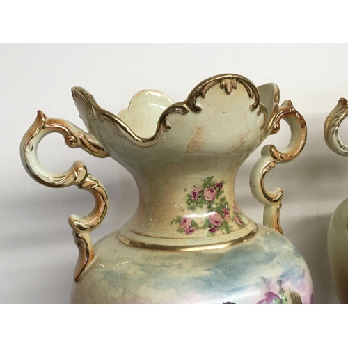 1064 - A pair of Victorian vases decorated with hand painted panels of classic scenes and pink rose designs... 