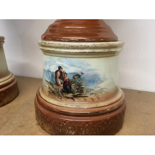 1064 - A pair of Victorian vases decorated with hand painted panels of classic scenes and pink rose designs... 