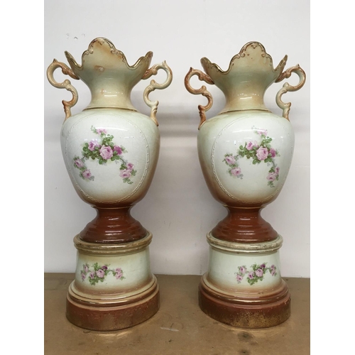 1064 - A pair of Victorian vases decorated with hand painted panels of classic scenes and pink rose designs... 