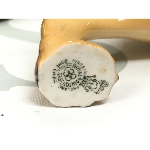 1071 - Four porcelain dog figures including Beswick, Sylvac and Royal Doulton. This lot cannot be posted