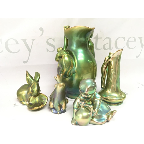 1072 - A collection of Zsolnay Pecs lustre glazed pottery Figures and a jug. This lot cannot be posted