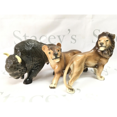 1074 - Three ceramic animals including West German Made lions and a Melba Ware buffalo . This lot cannot be... 