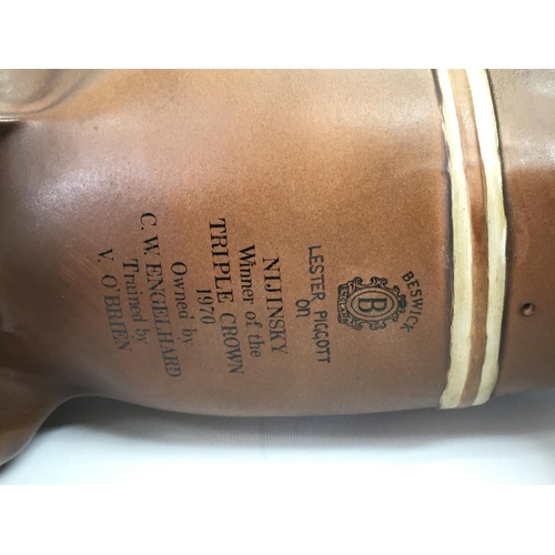 1076 - A Beswick Nijinsky Winner of the Triple crown 1970 ceramic figure. 33cm tall 32cm long. This lot can... 