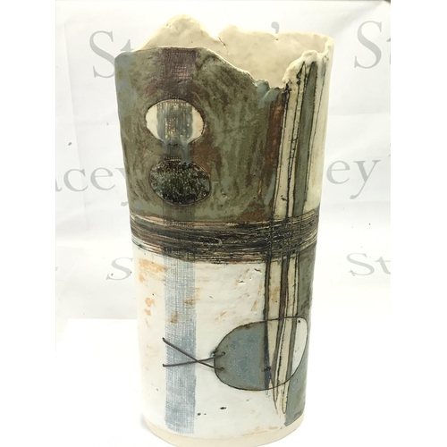 1087 - A tall studio pottery vase , 40cm tall. This lot cannot be posted