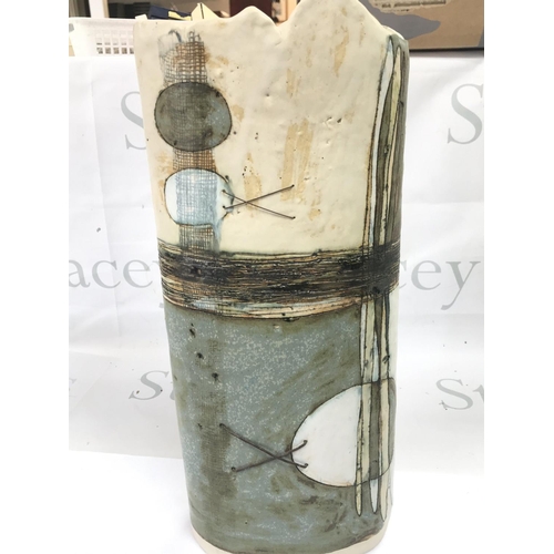 1087 - A tall studio pottery vase , 40cm tall. This lot cannot be posted