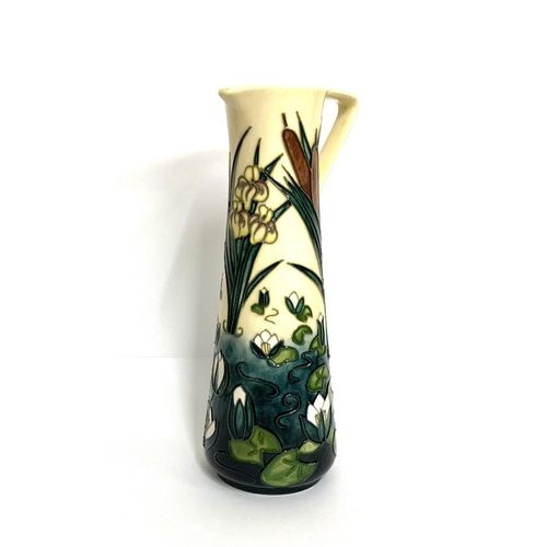 1093 - A modern Moorcroft, Lamia pattern jug designed by Rachel Bishop, the cream ground decorated with flo... 