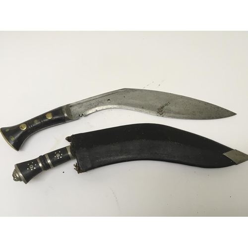 Two Kukri knifes the National weapon of Napul one without a scabbard ...