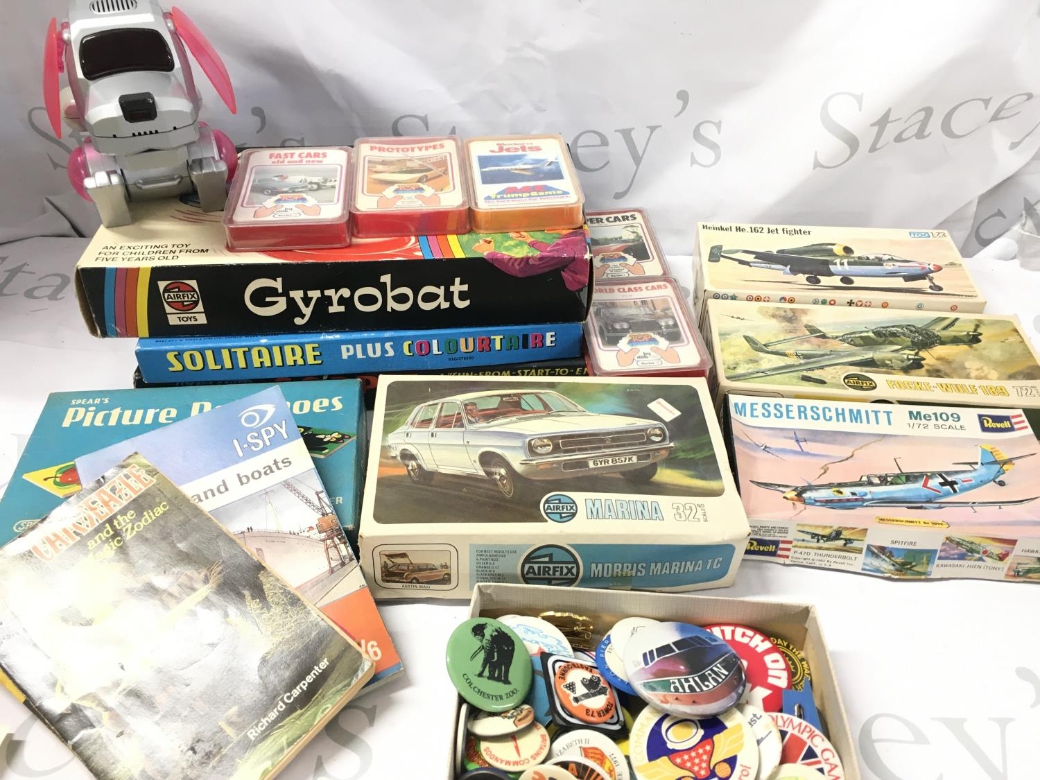A Box Containing Boxed Model Kits. Board Games. Marbles. Matches ...