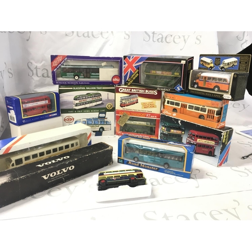 A collection of boxed diecast buses and trams by a variety of ...