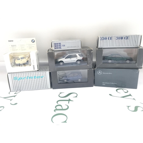 105 - A Collection Of Boxed Mercedes-Benz Dealers Cars And A BMW Isetta.