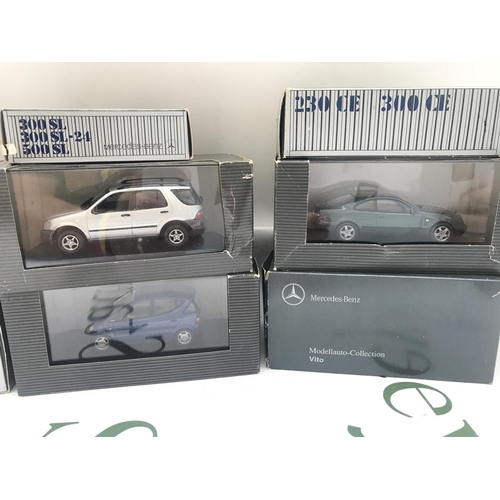 105 - A Collection Of Boxed Mercedes-Benz Dealers Cars And A BMW Isetta.