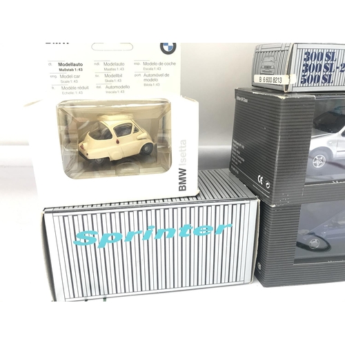 105 - A Collection Of Boxed Mercedes-Benz Dealers Cars And A BMW Isetta.