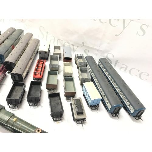 67 - A Collection of 00 Gauge Locos. Wagons. Coaches. Buildings Etc.