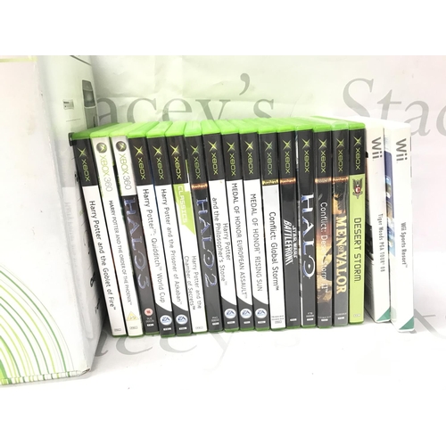 76 - A Boxed Microsoft Xbox 360 with A Collection Of Games.