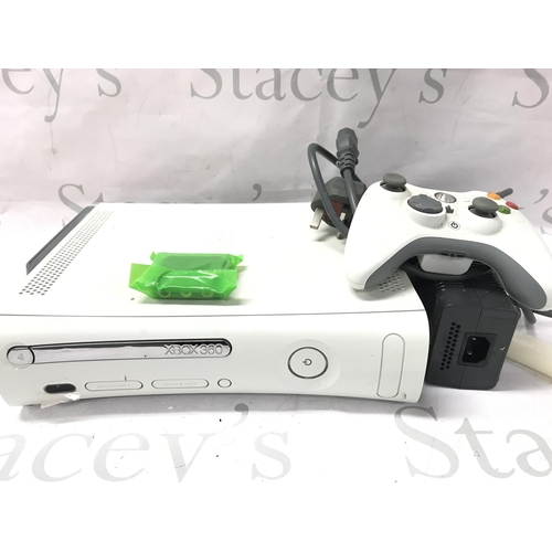 76 - A Boxed Microsoft Xbox 360 with A Collection Of Games.