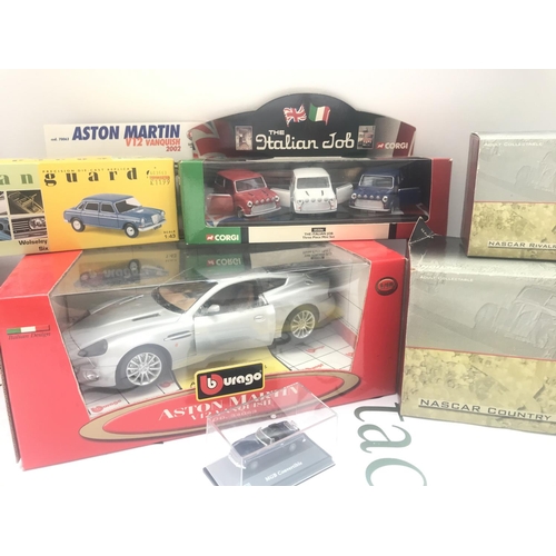 94 - A Collection of Boxed Diecast Including Burago. Corgi. Vanguards And NASCAR.