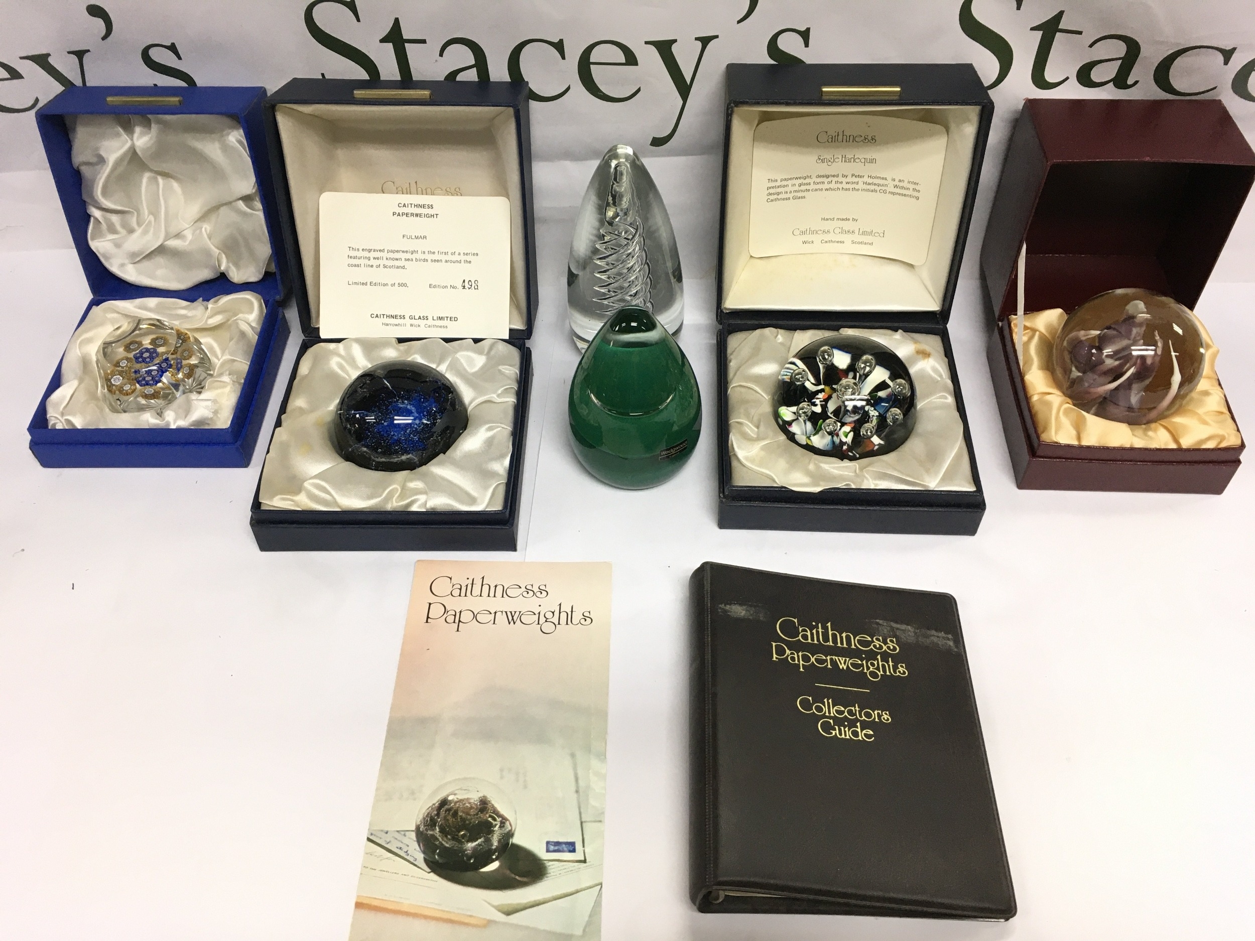 Six glass paperweights comprising g four boxed examples including two ...
