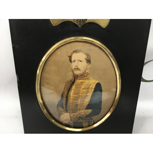 805 - A framed ebonised photograph portrait of a gentleman in military dress. NO RESERVE