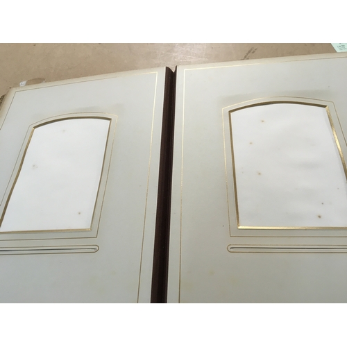 810 - A Victorian photo Album inset with a music box .- NO RESERVE