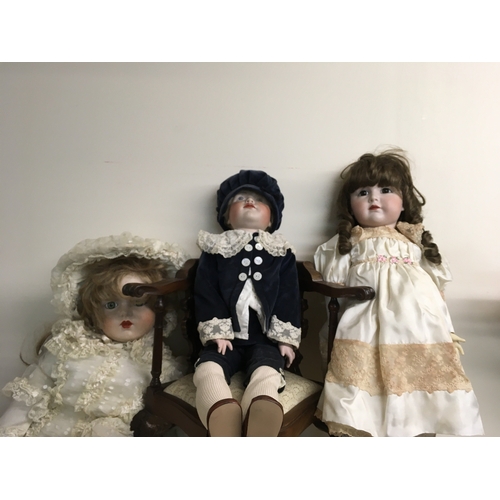 830 - Three Victorian style dolls together with a reproduction dolls corner chair (No reserve) .
